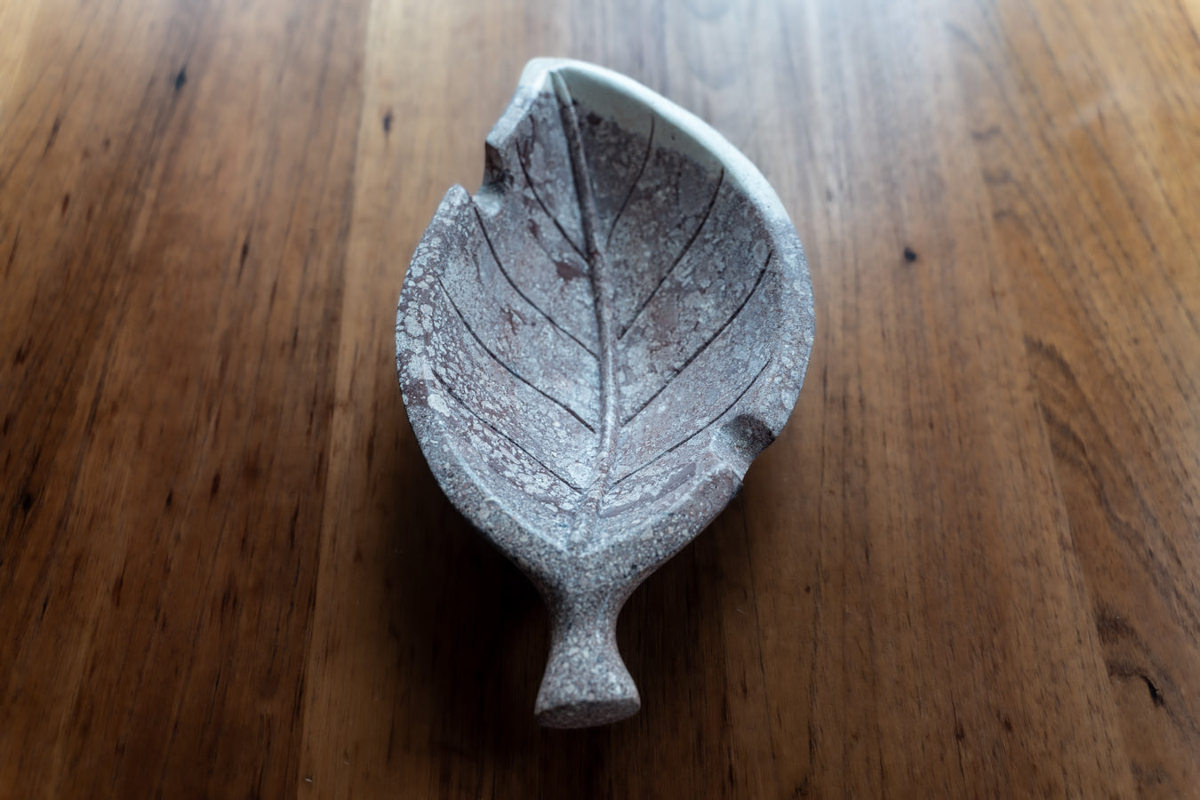 Hand carved stone tobacco leaf ashtray